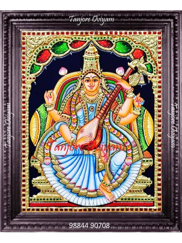 Hand-painted Saraswathi Tanjore painting with veena, gold foil and traditional arch detailing